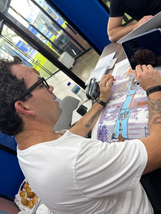 Marcelo Zuffo working on a drawing in Miami